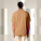 Unisex polo tričko Prepster 2.0 - stpu222-latte_studio_lifestyle_main_back - variant Eg STPU222C1121L
