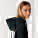 Unisex mikina s kapucňou voľného strihu Slammer - stsu856-black_studio_lifestyle_detail_front - variant Eg STSU856C0021L