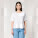 Stella Collider dámske tričko s vyhrnutým rukávom - sttw089-white_studio_lifestyle_main_front - variant Eg STTW089C0011L